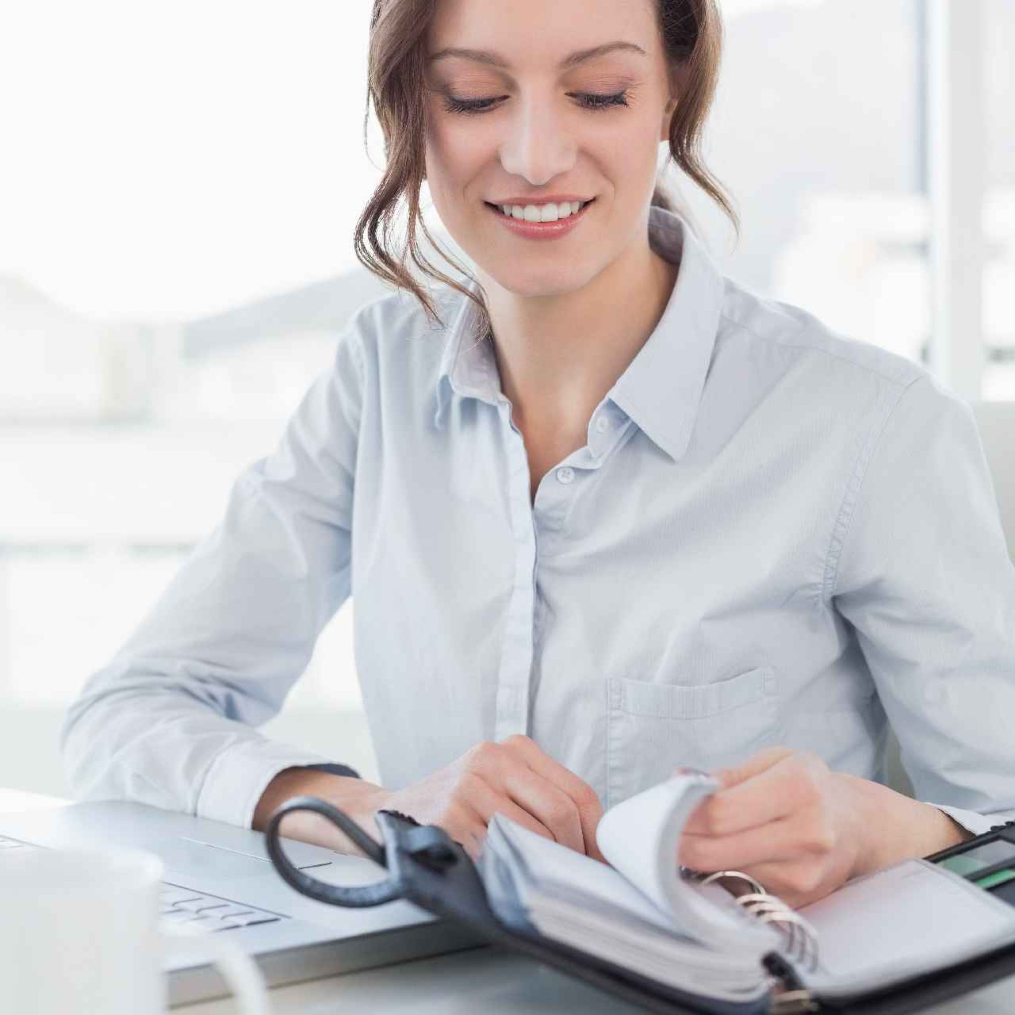 businesswoman-with-laptop-diary-office (2)