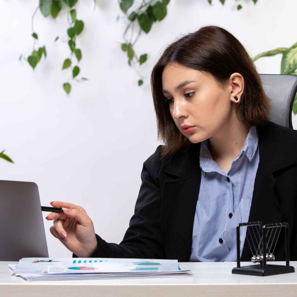 front-view-beautiful-young-businesswoman-black-jacket-blue-shirt-working-with-laptop-front-table-business-job-office (1)